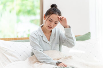 体調不良の女性